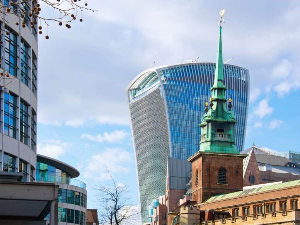 Walkie talkie building in london with green spire in front